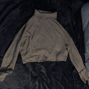 Dark gray turtleneck sweater.